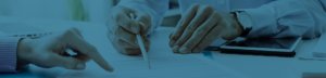 two people draw up compliance documents