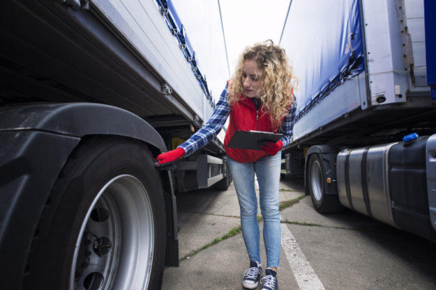 Checking tires. Truck transportation.