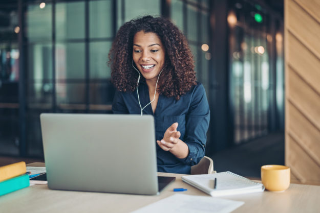 Smiling businesswoman during a video call in the office
