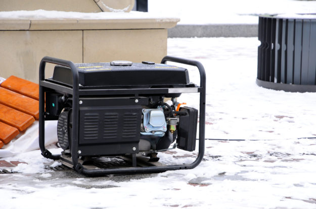Portable electric generator running in the cold winter.