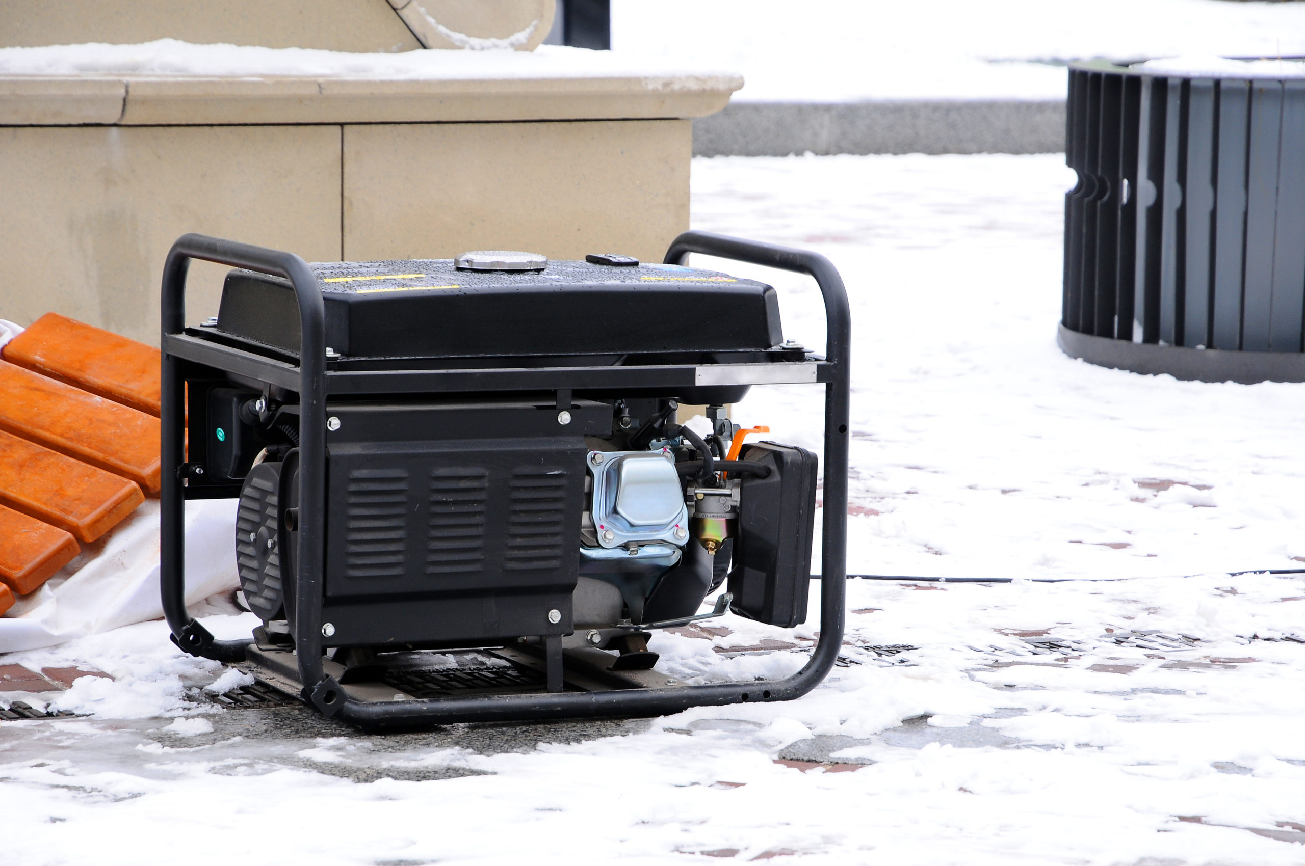 Portable electric generator running in the cold winter.