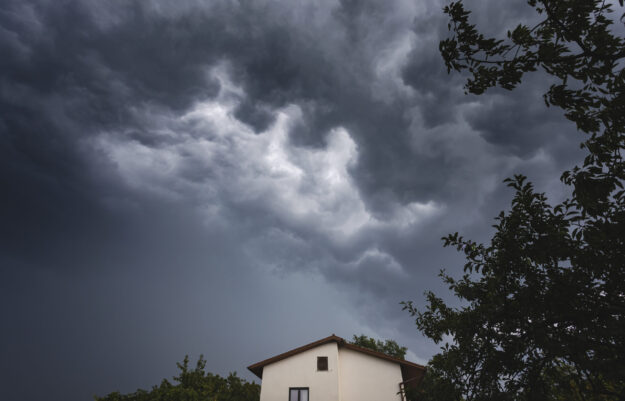 Dark Clouds Sky with Rain Above House