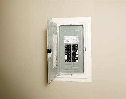 breaker Residential electrical box, open to reveal circuit breakers inside.