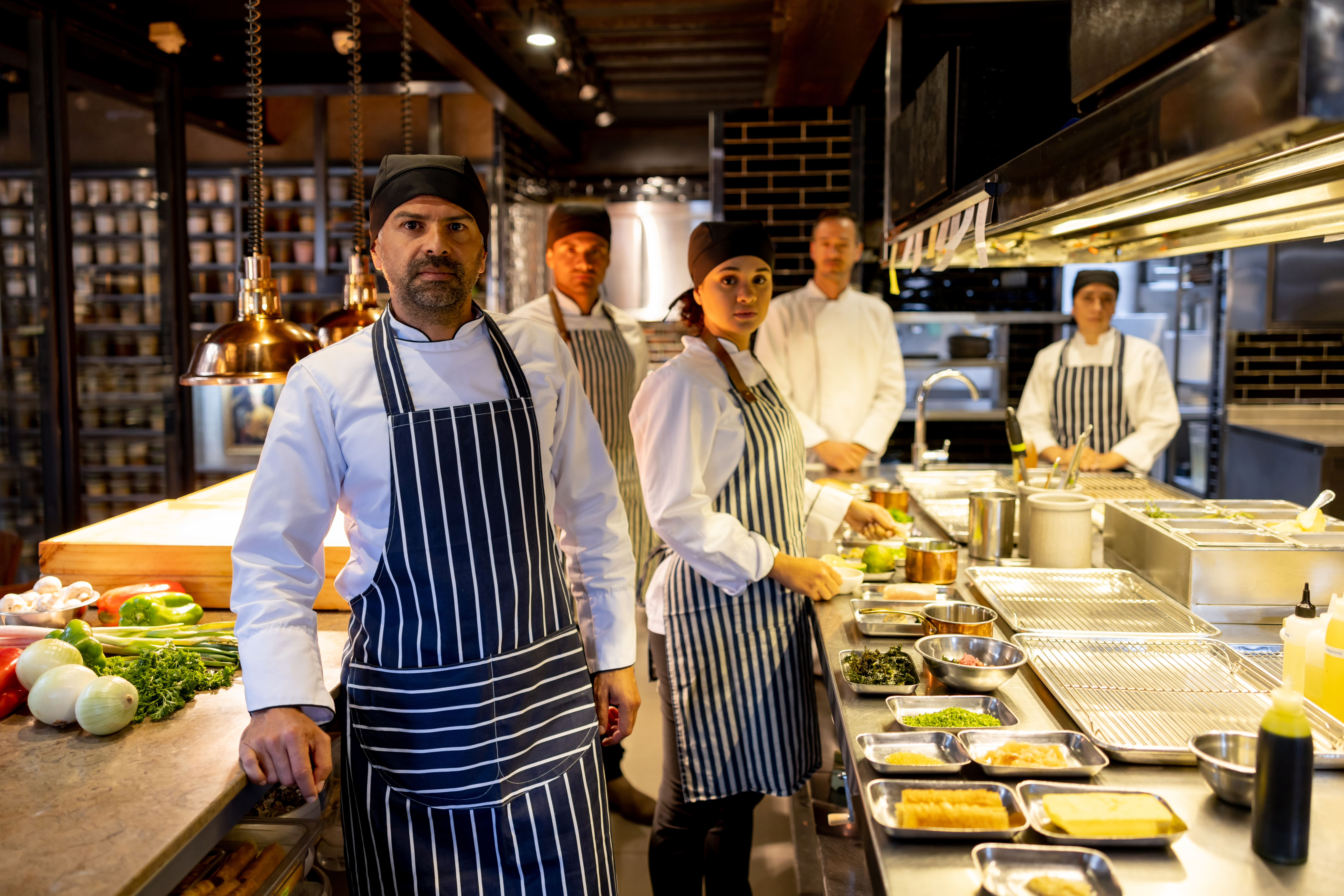 Group of chefs and cooks working in the kitchen at a restaurant Restaurant kitchen staff