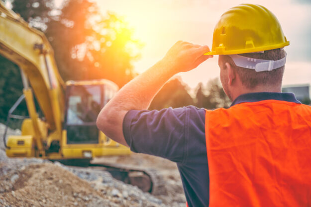 Construction Worker Construction professional working ourdoors in the summer heat