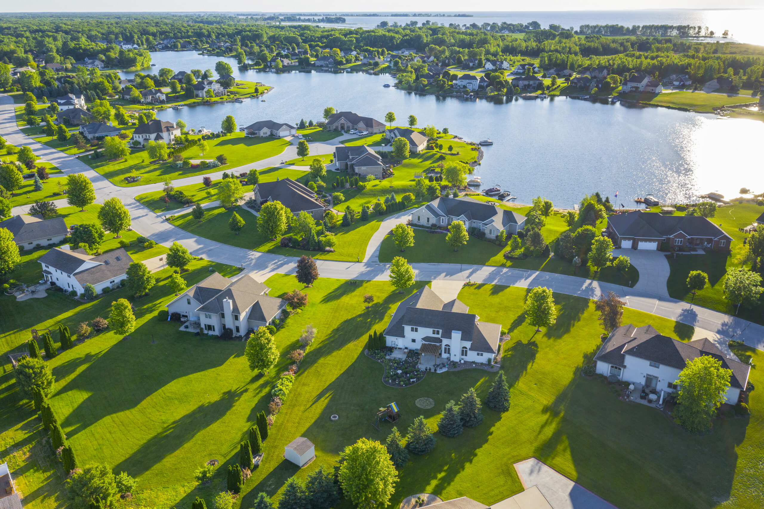 Beautiful Waterfront Homes On Lake At Sunrise In Summertime. Beautiful Waterfront Homes At Sunrise In Summertime